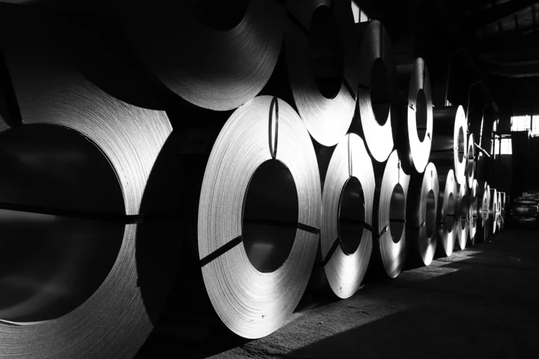 Canada aluminum tariff war: rolls of steel are lined up in a warehouse